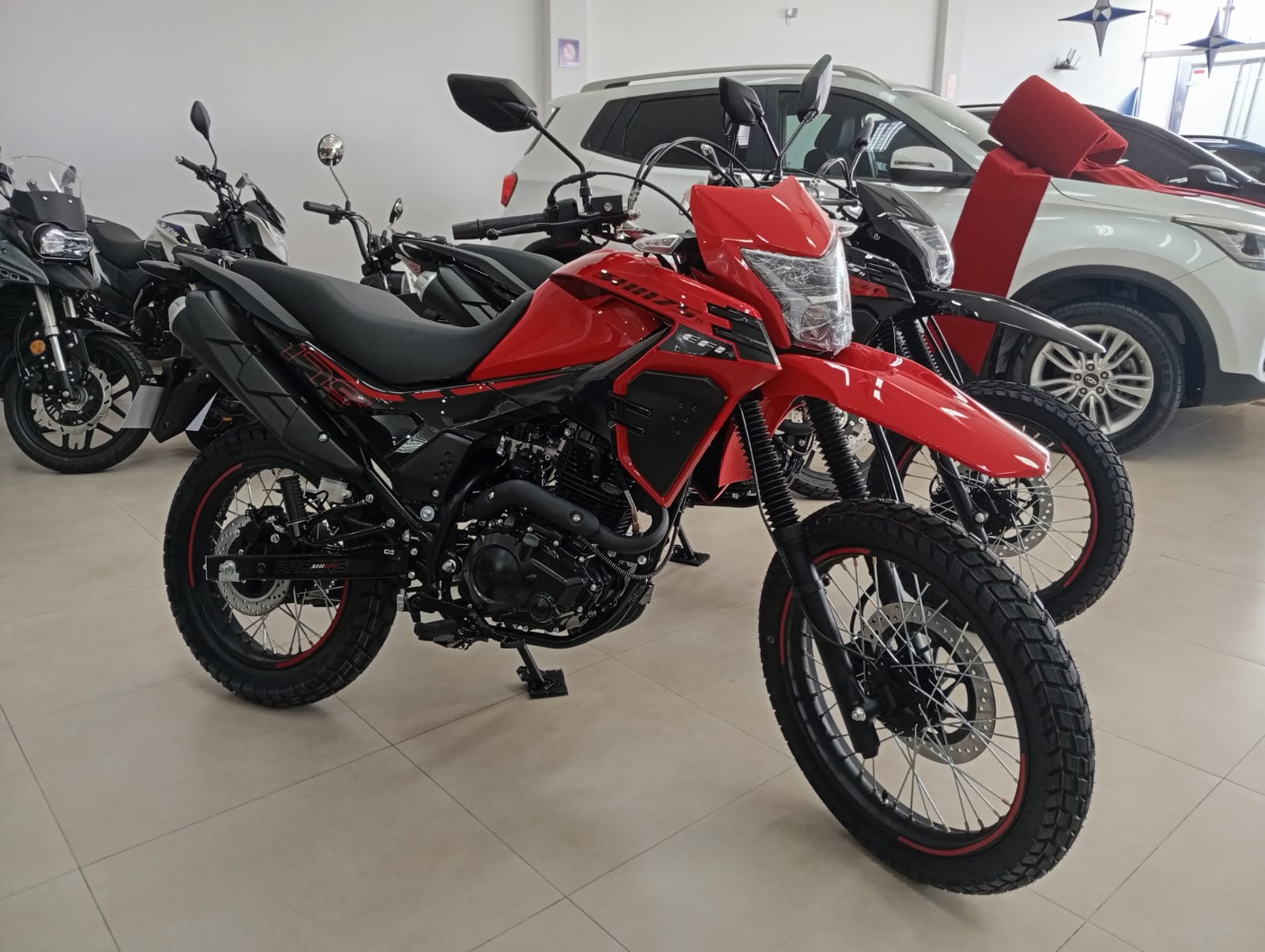 Shineray SHI 175s EFI vermelha – 2026 - Grupo Michelin Shineray SHI 175s EFI vermelha – 2026 - Grupo Michelin